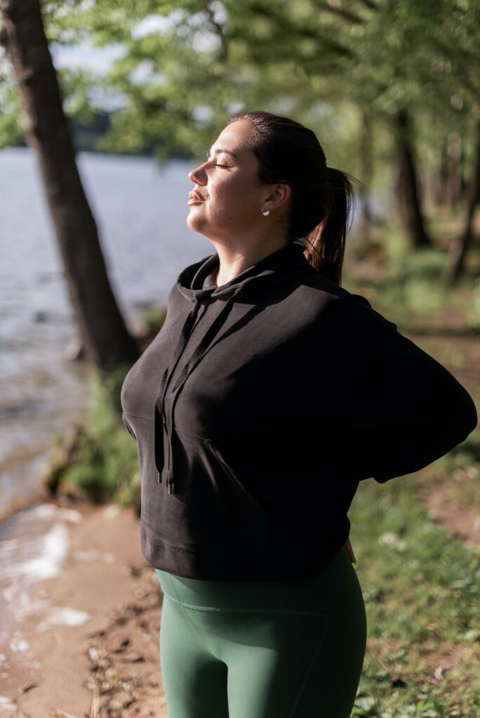 woman stretching and deep breathing fresh air