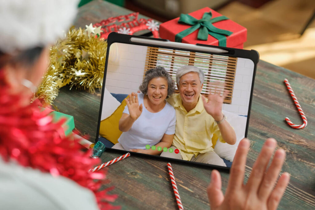 christmas new year video call with famliy with tablet together home