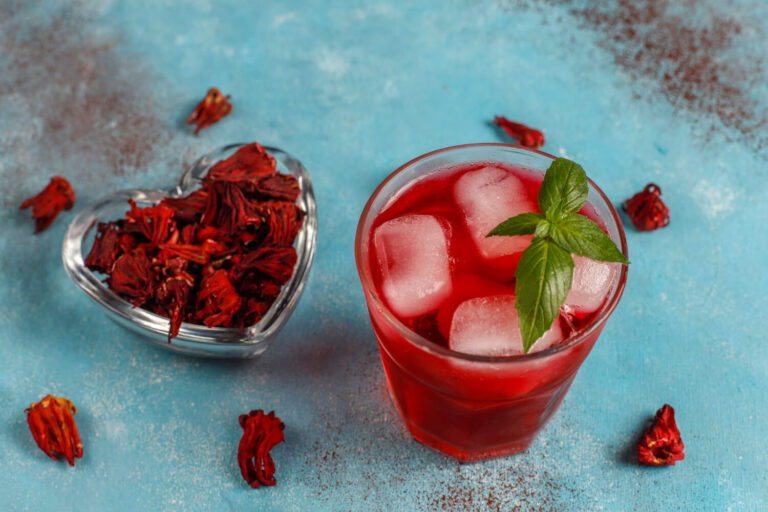 cold brew hibiscus tea with ice basil leaves