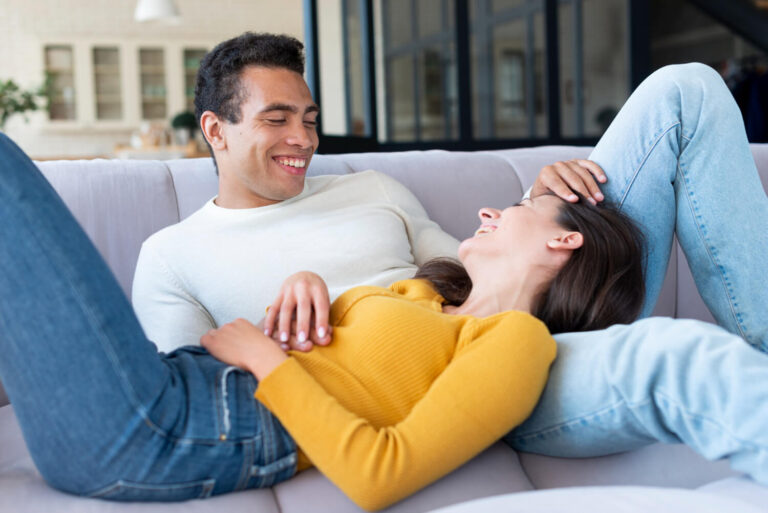 couple relaxing on sofa