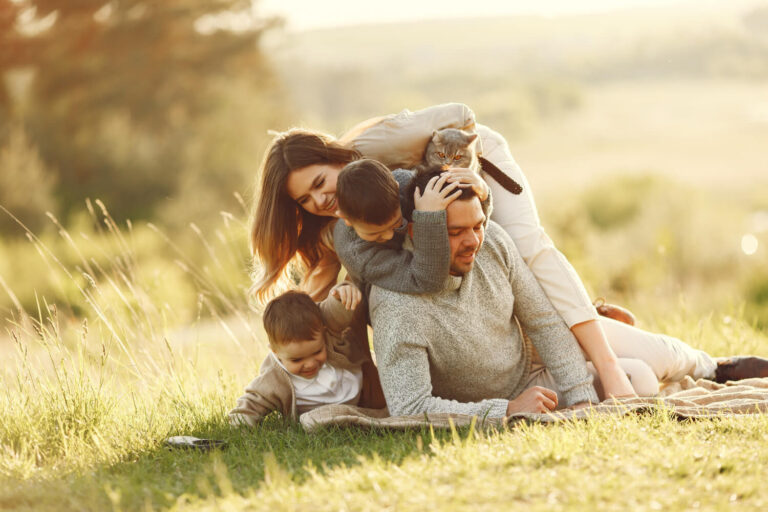 cute family playing summer field