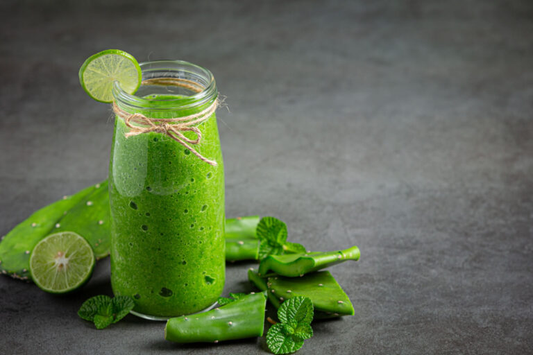 glass aloe vera juice put dark floor