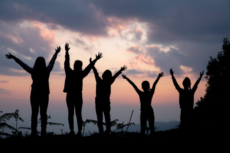 group happy people playing summer sunset nature