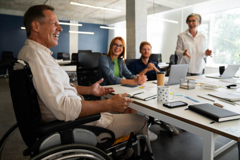 man wheelchair having inclusive office job