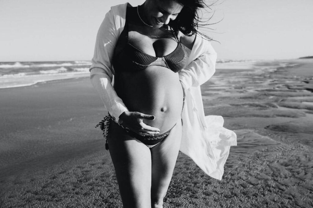 woman wearing bikini enjoy moment which is a Natural Remedies for anxiety during pregnancy