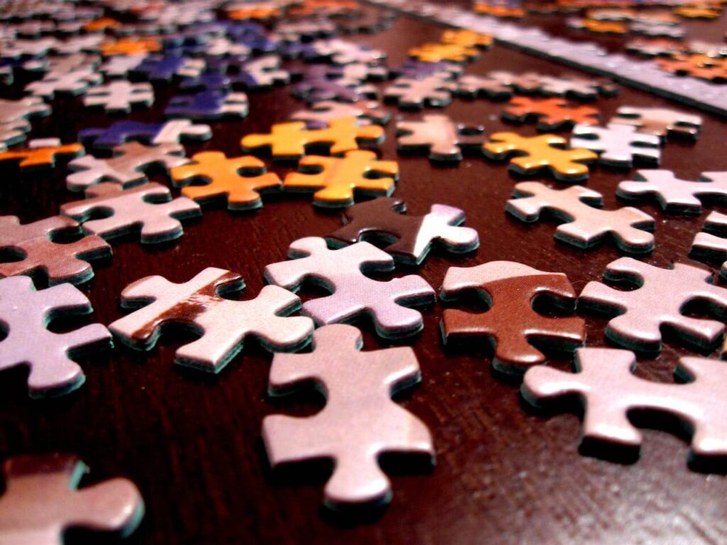 selective focus photography of assorted color puzzle pieces