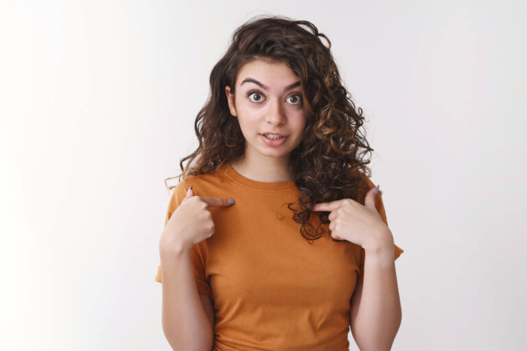 shocked intense bothered young armenian woman surprised someone accused her fault pointing herself confused frustrated raise eyebrows questioned arguing friend standing white background