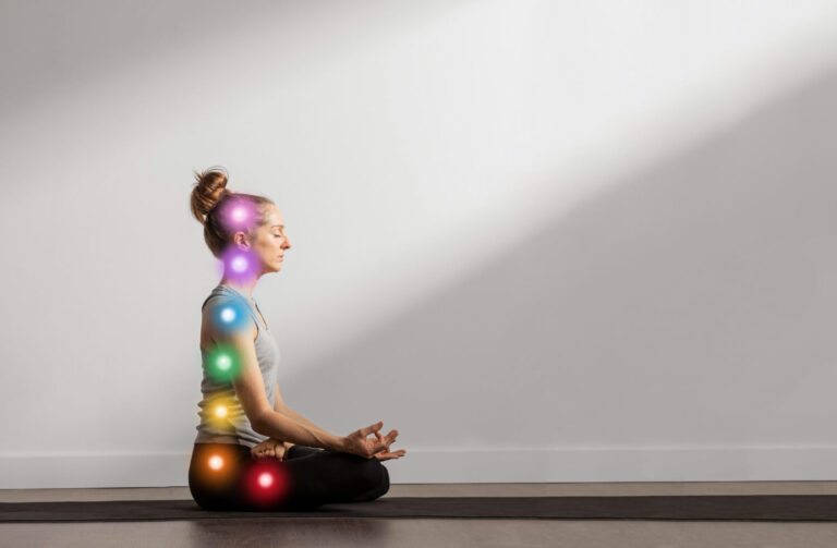 woman maintaining asana while chakra points are aligned