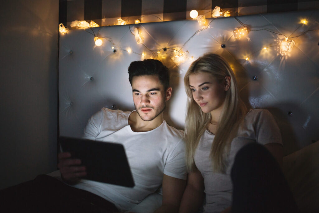 couple watching film tablet