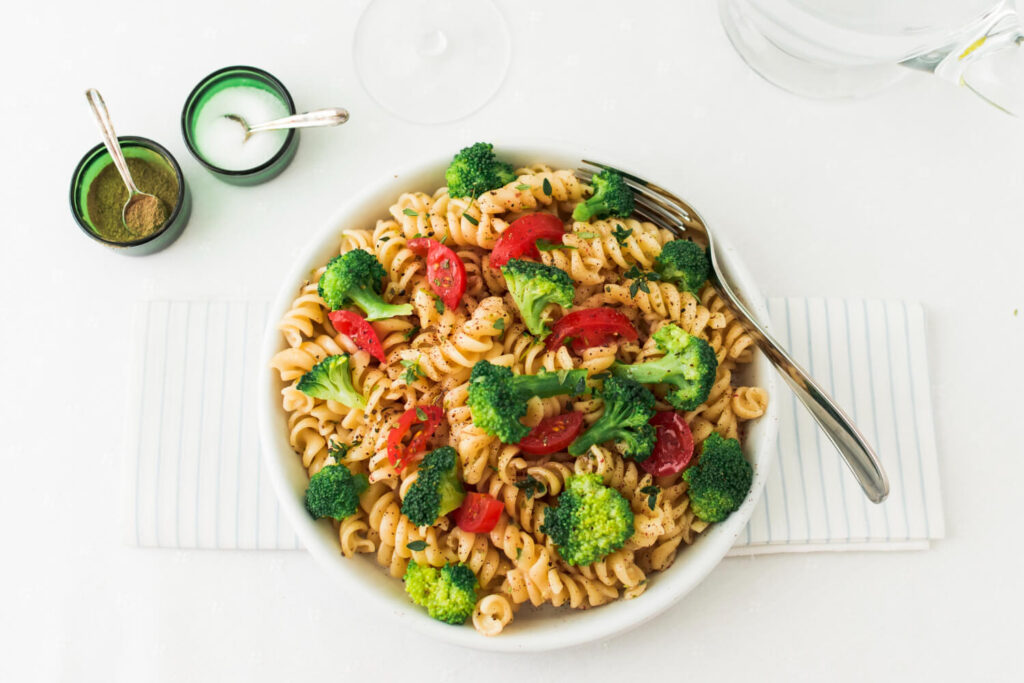 fusilli pasta salad with tomato broccoli napkin