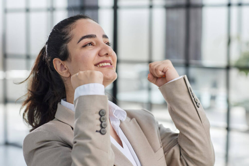 photo young overjoyed office assistant girl raise fists up