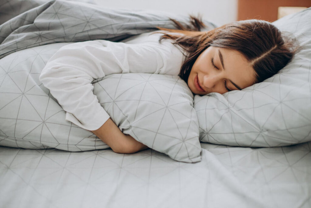 young woman sleeping her bed