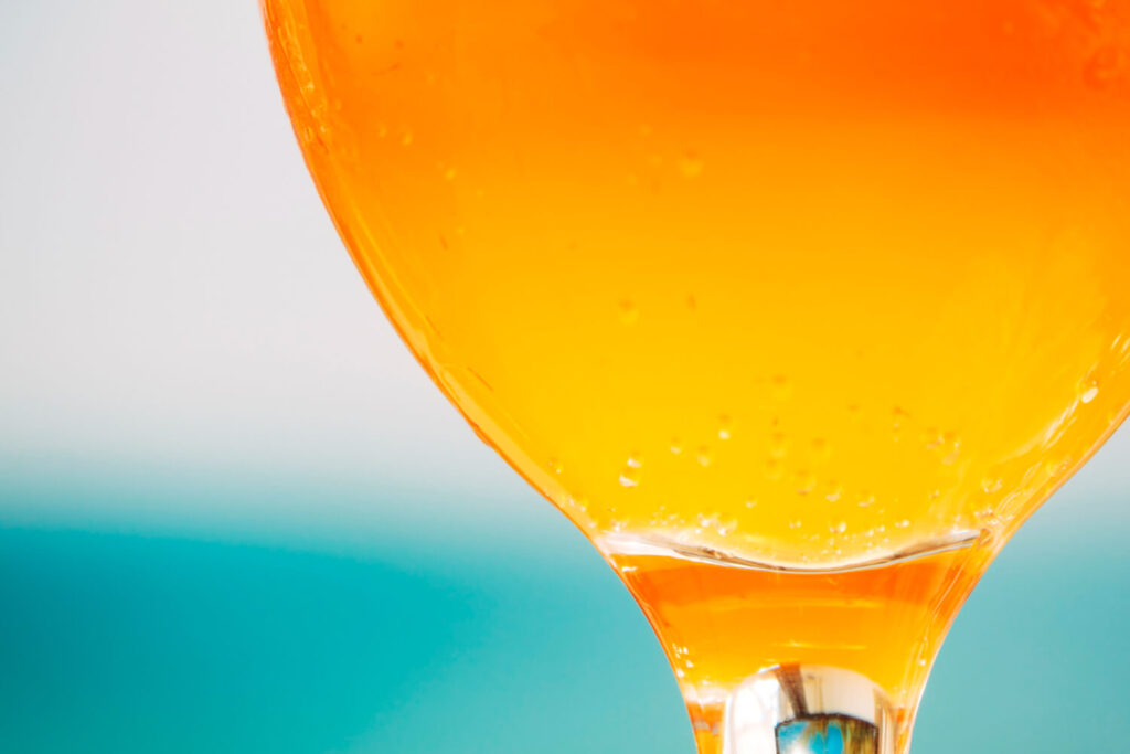 bright orange fresh drink round glass