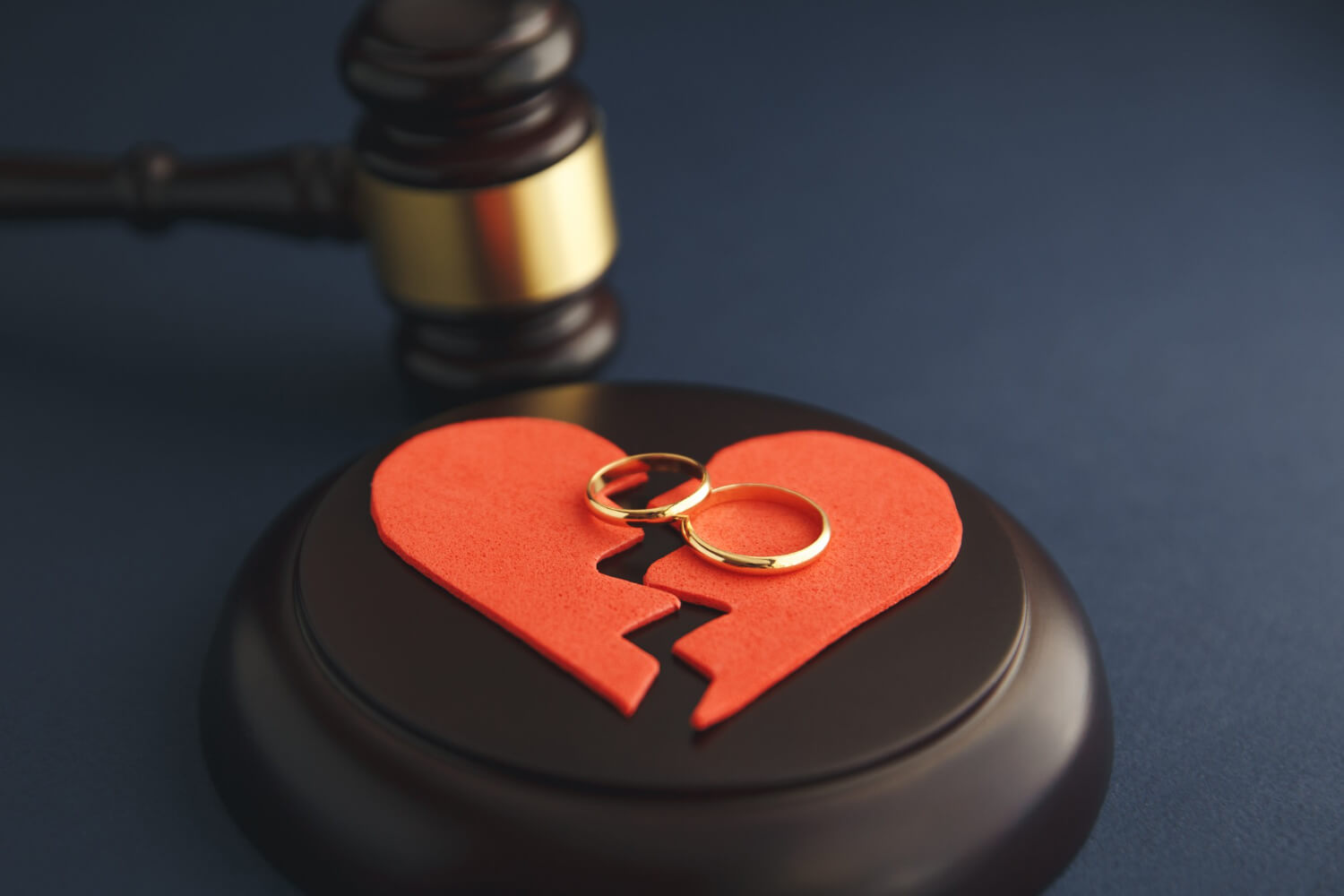 wedding rings figure broken heart from tree hammer judge wooden background divorce proceedings