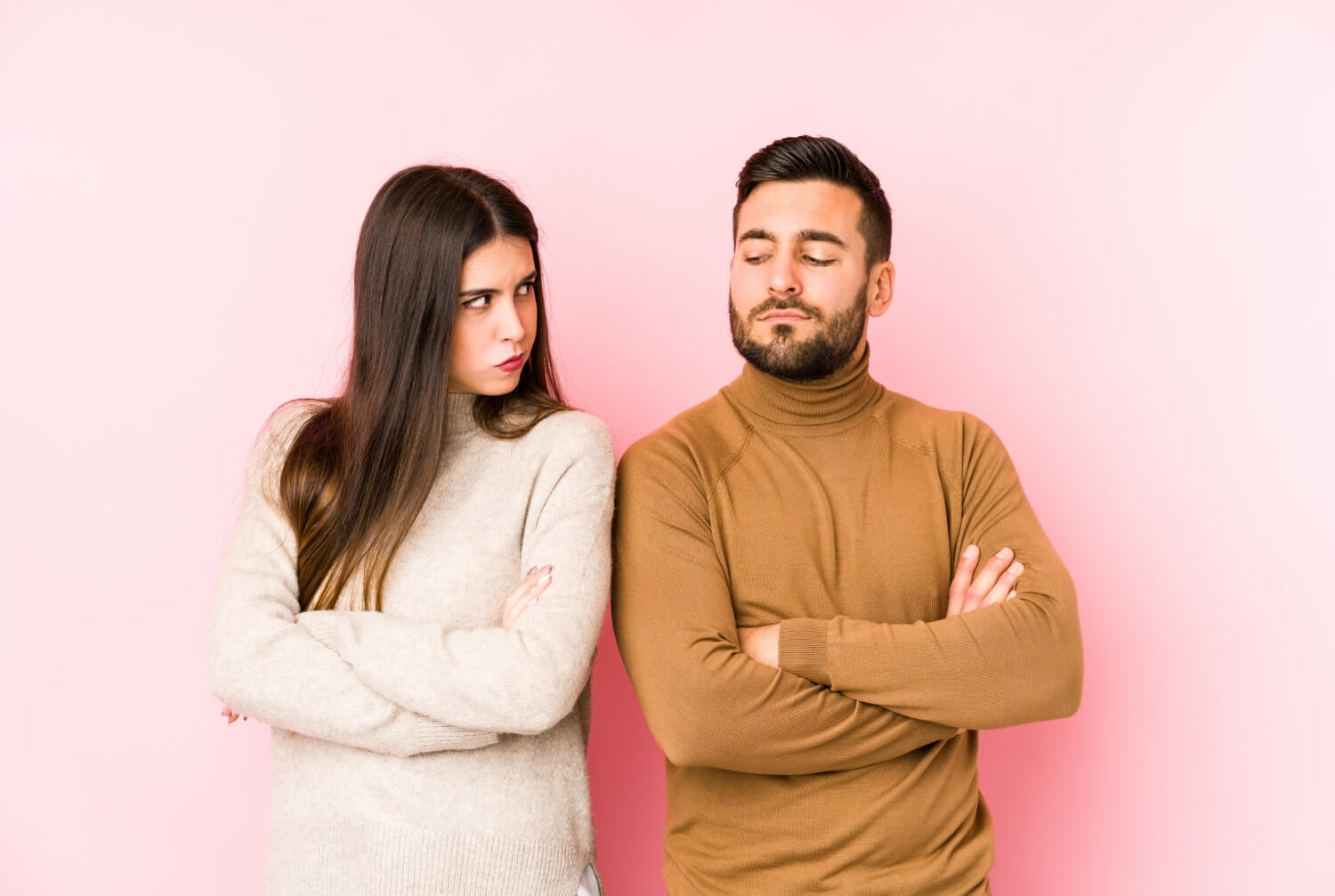 young caucasian couple frowning face displeasure keeps arms folded