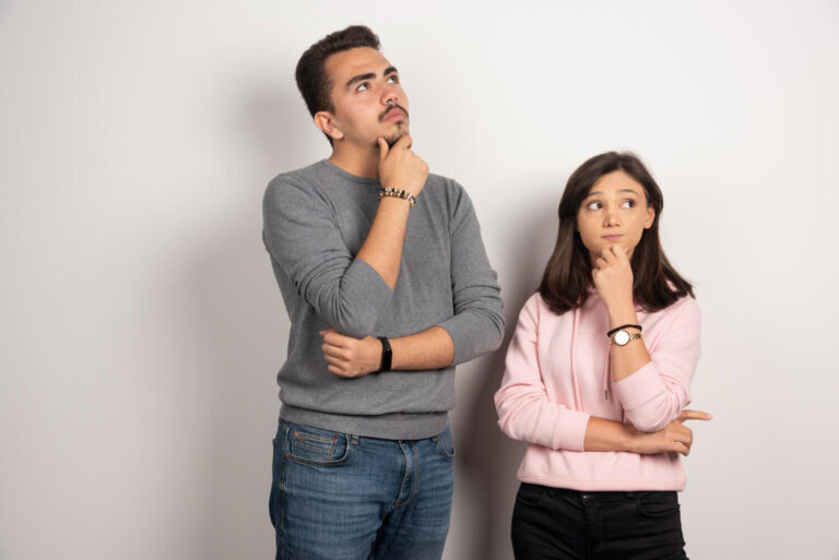 young couple thinking white